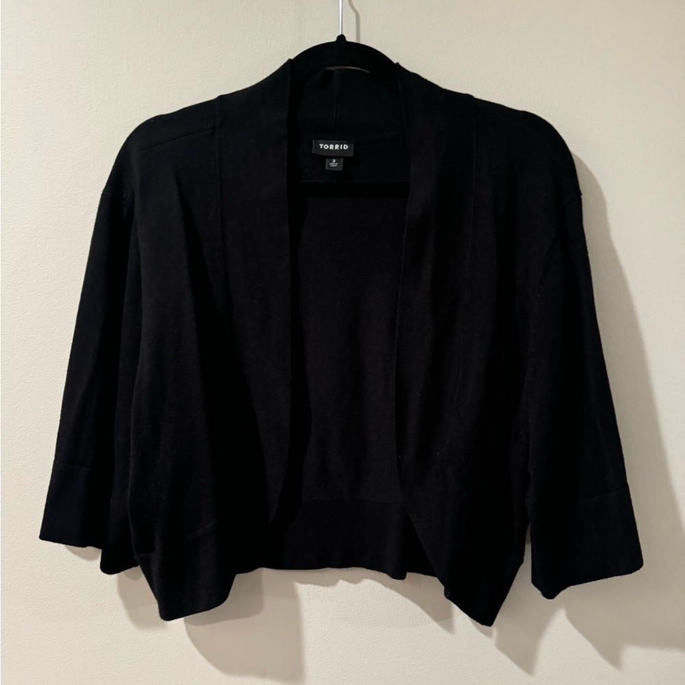 Black bolero style sweater three-quarter length sleeves